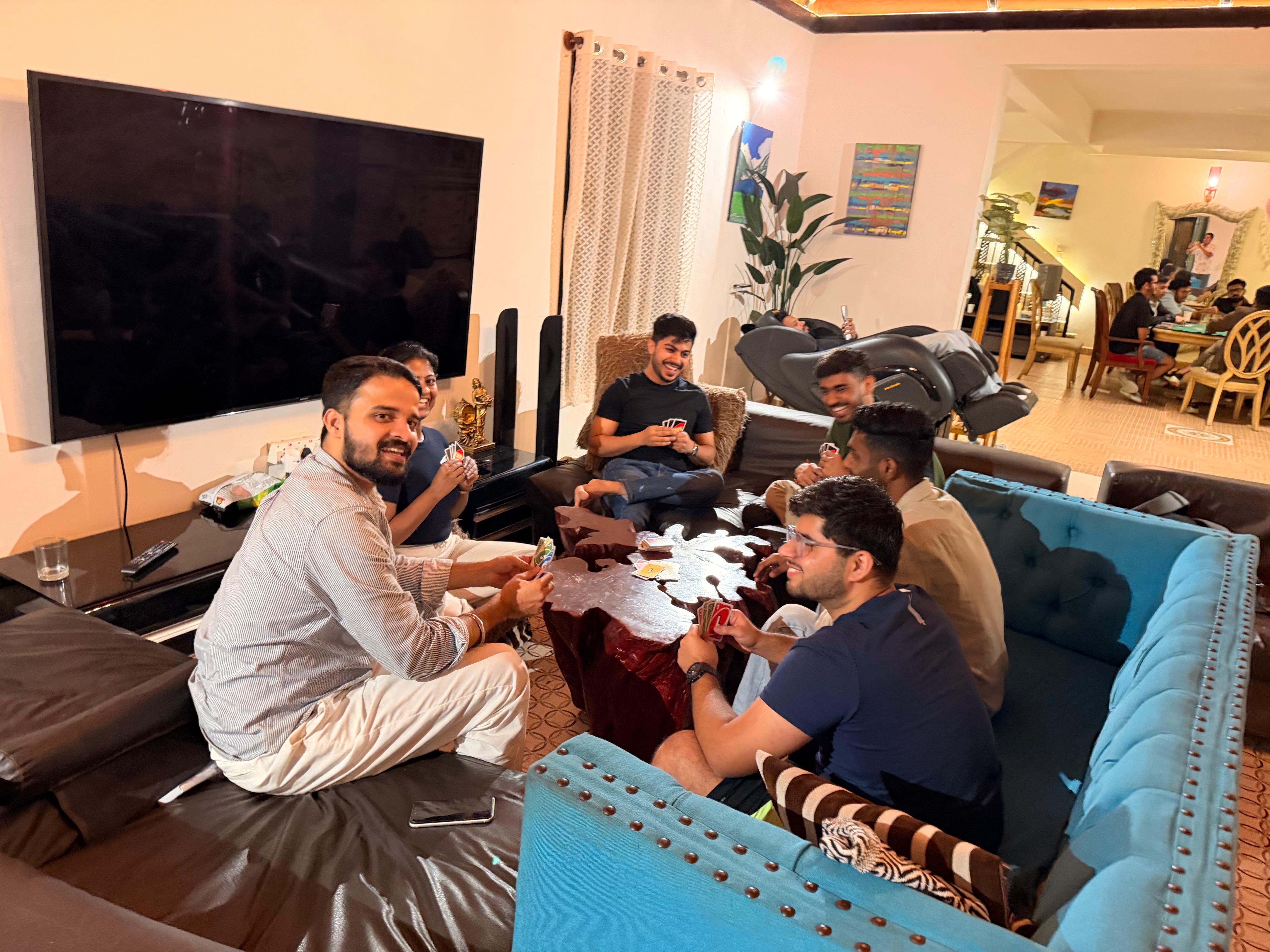 Trivas team playing cards during an offsite, shot one