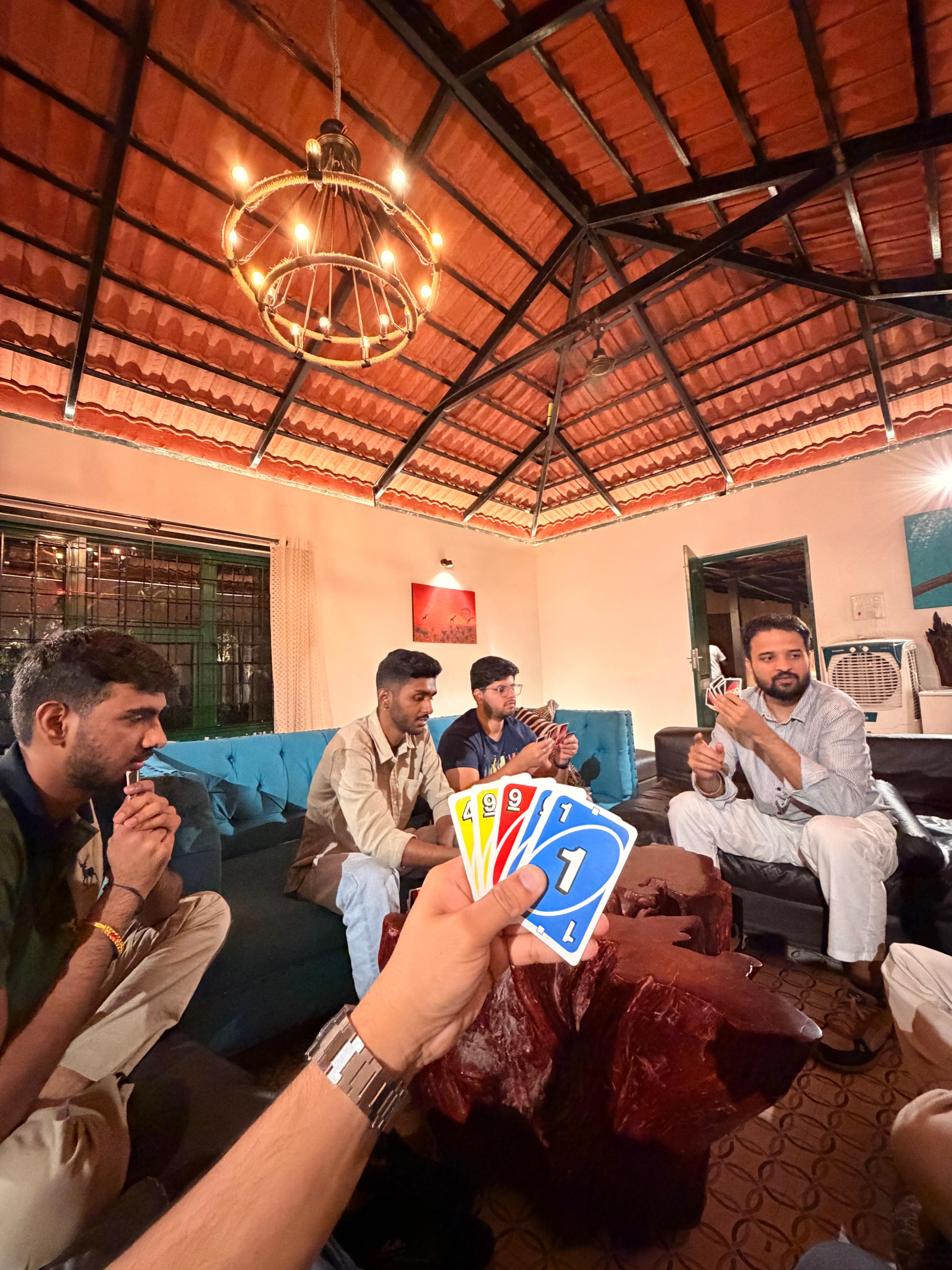 Trivas team playing cards during an offsite, shot two