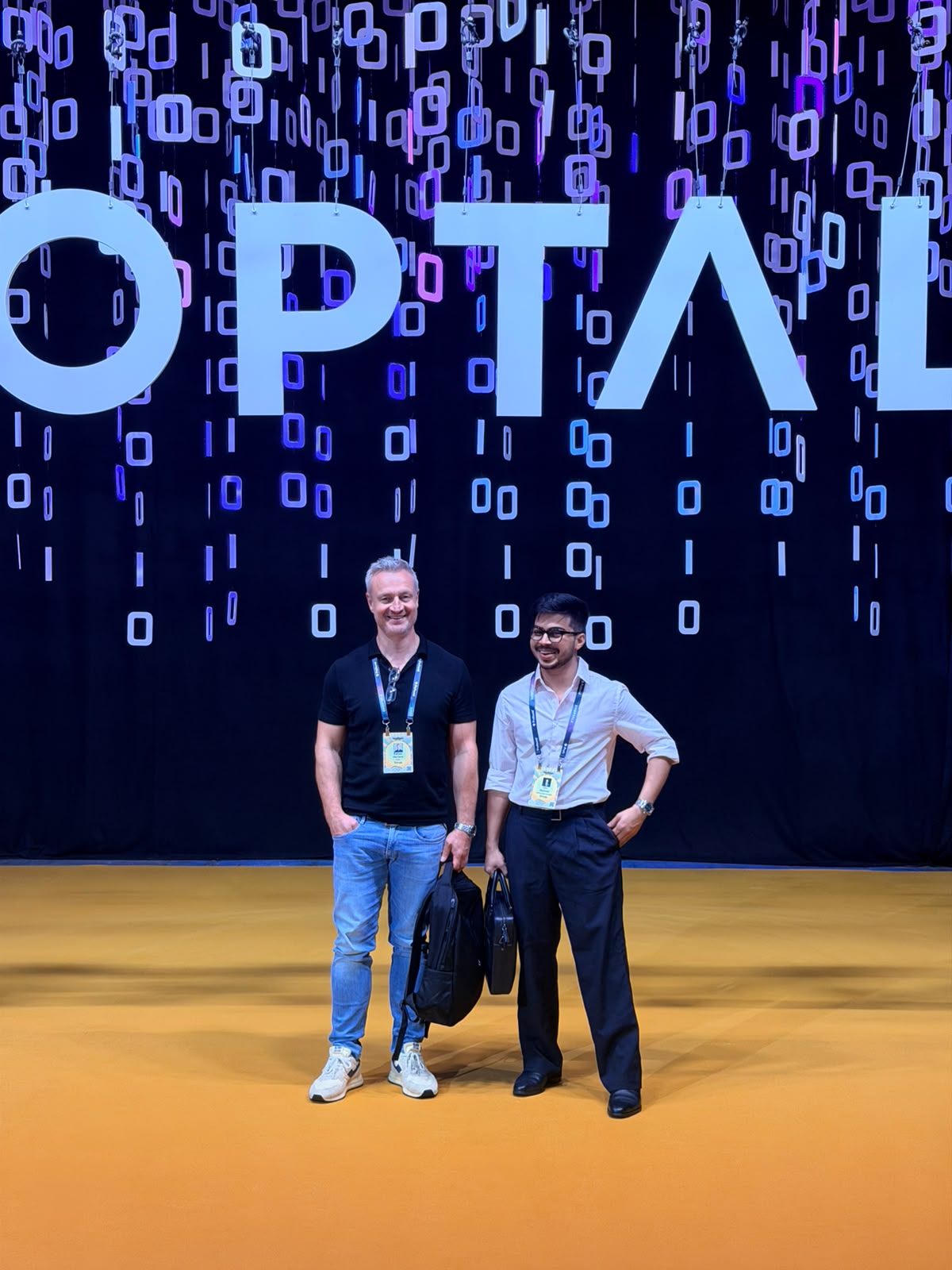 Trivas teammates at the Optaal stage backdrop